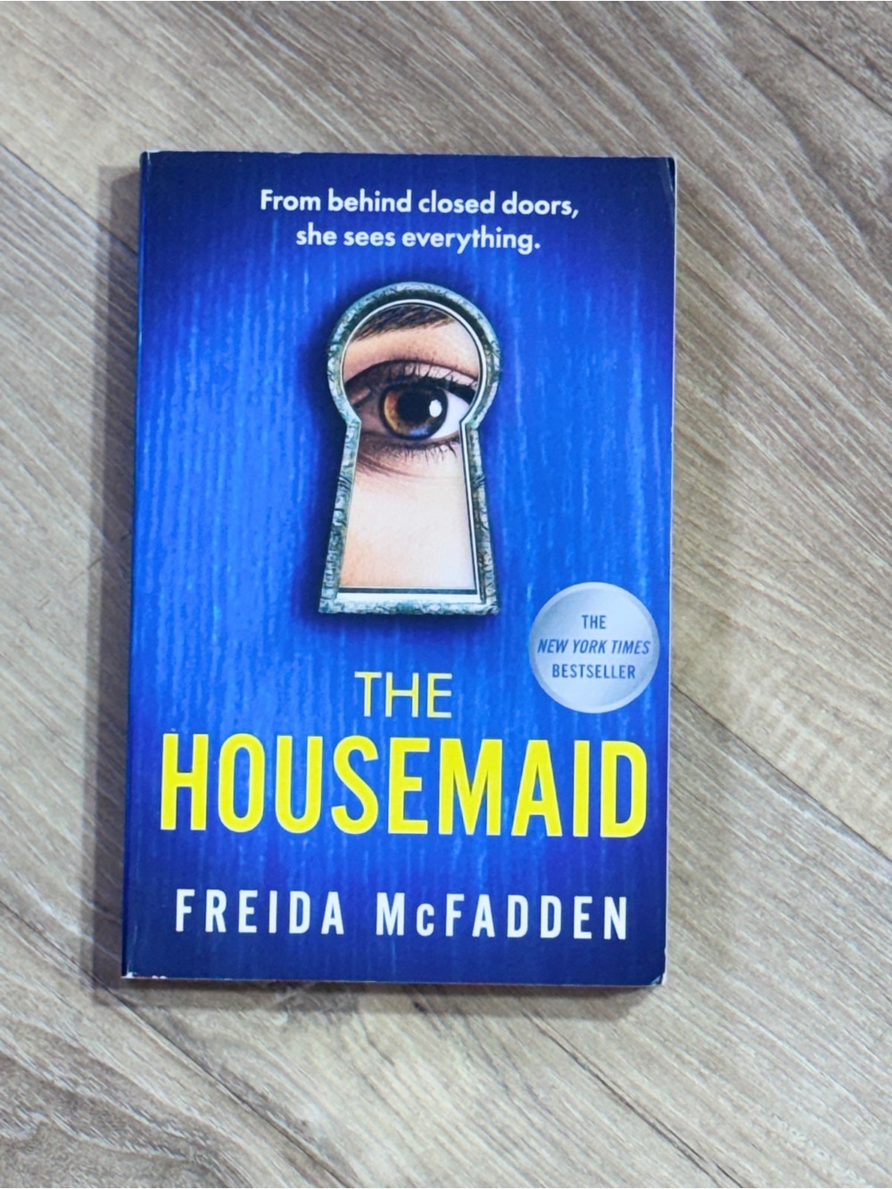 The Housemaid by Freida McFadden - Blue & Yellow Paperback